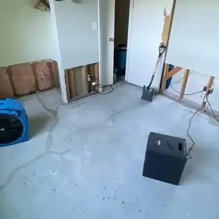 Air movers and dehumidifier drying opened drywall for Center Line homes
