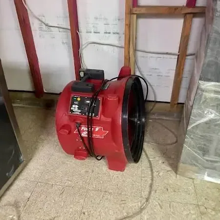 Red air mover and plastic sheeting at an opened wall, Hamtramck
