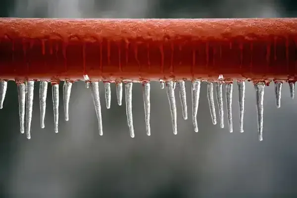 Icicles hanging from a frozen pipe before it split